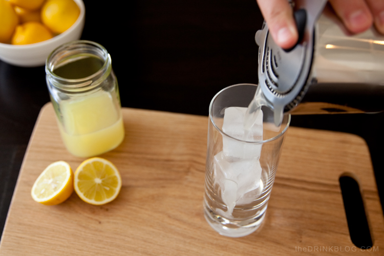 pouring a tequila collins