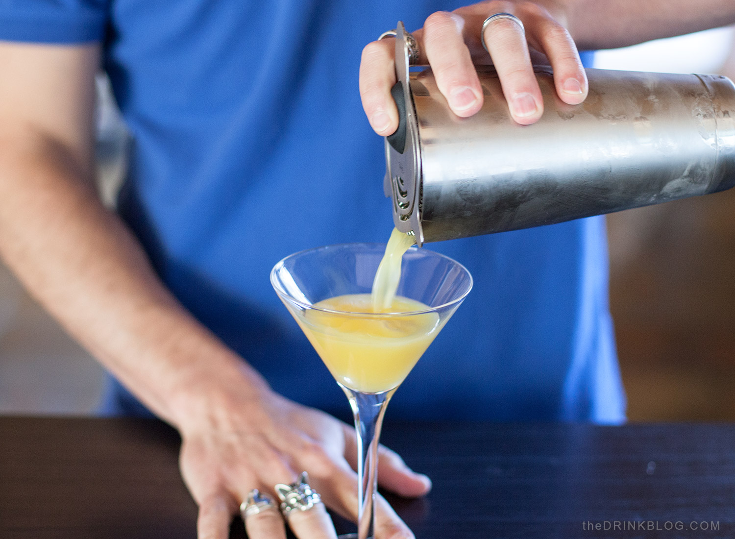 pour cocktail into glass