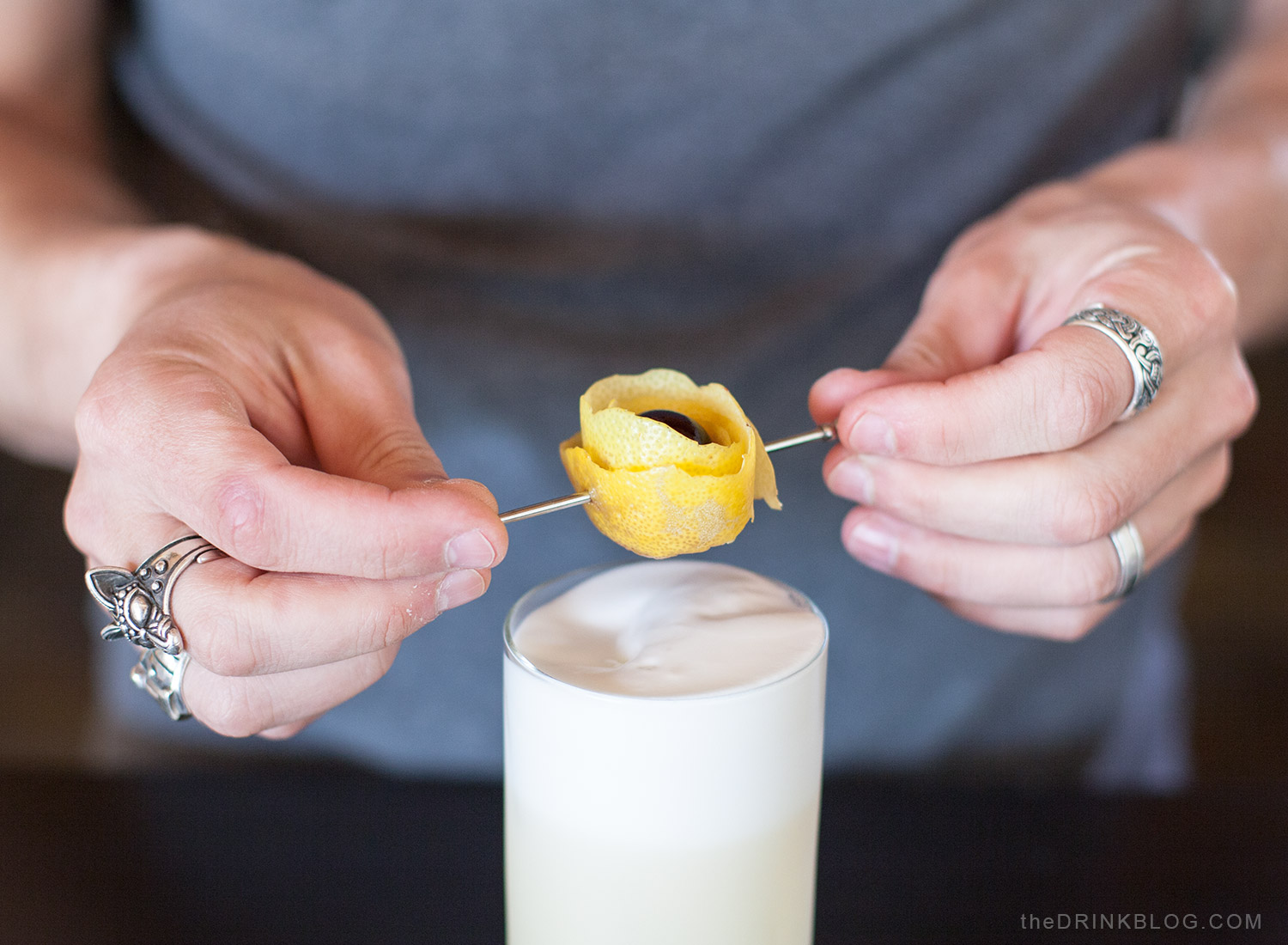 garnish with lemon peel and cherry